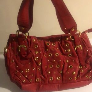 Red and gold grommet shoulder bag